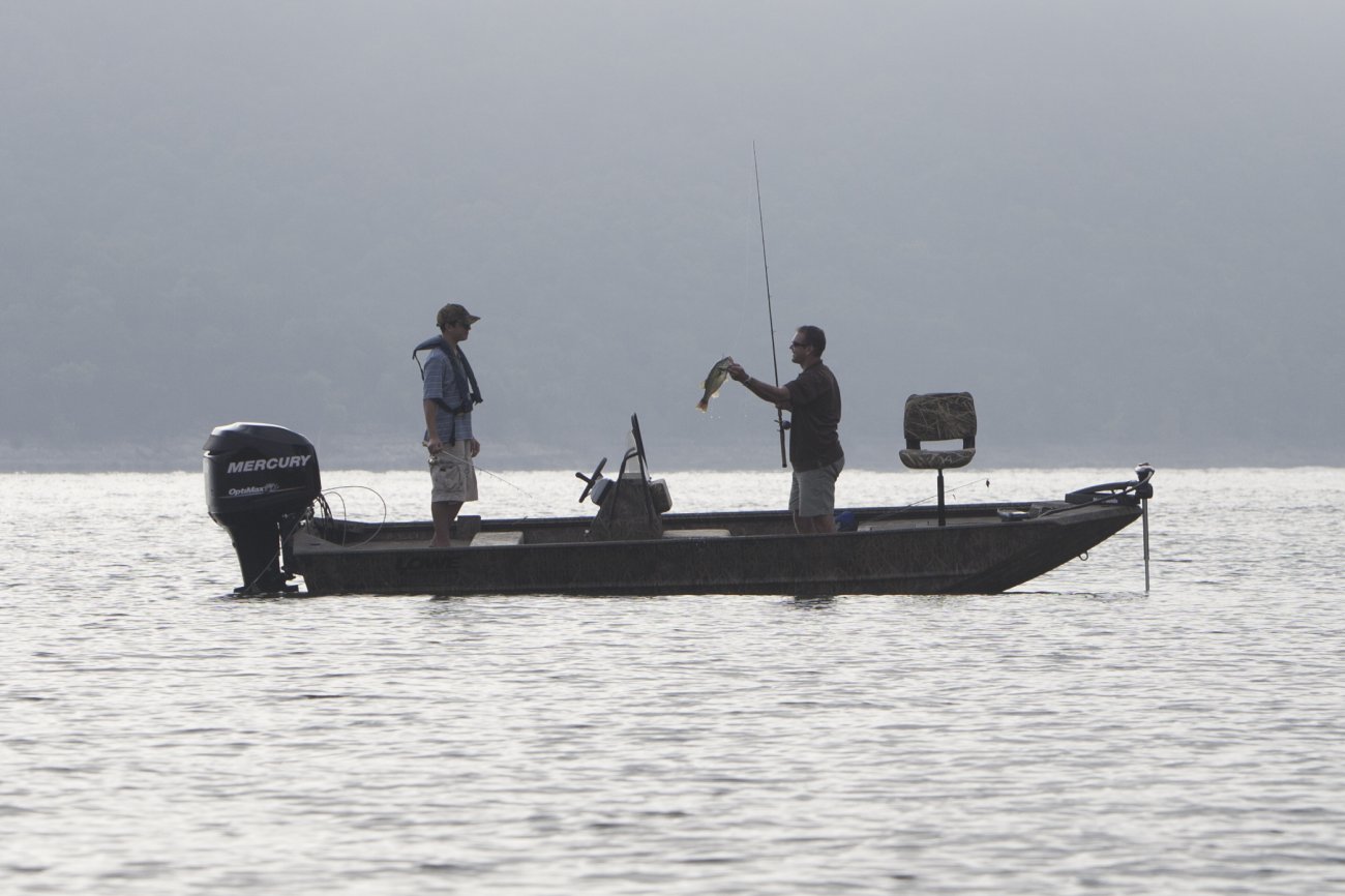 A Jon boat is a flat-bottomed boat made of aluminum or wood with one, two, or three bench seats. They are particularly useful for hunting due to the greater level of stability as compared with a V-hull boat. They are also quite suitable for fishing.