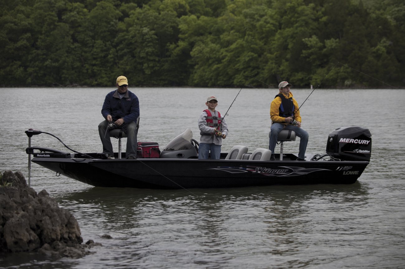 The definition of an outboard motor is a detachable engine mounted on outboard brackets on the stern of your boat.  This configuration will have only one single engine.