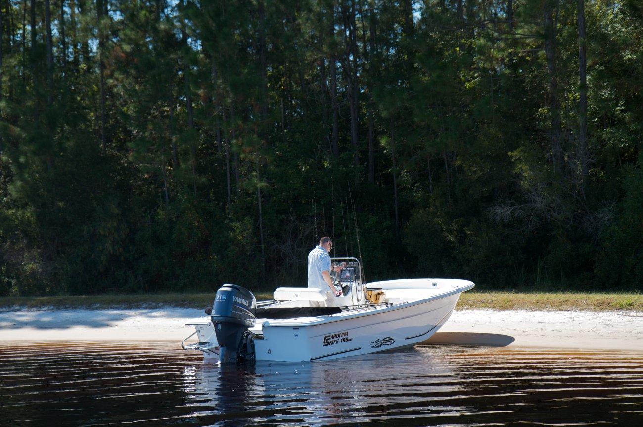 Center console is an open hull boat where the console of the boat is in the center. The boat deck surrounds the console so that a person can walk all around the boat from stern to bow with ease. Most center consoles are powered by outboard motors.