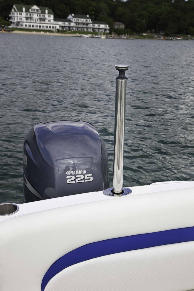 The definition of an outboard motor is a detachable engine mounted on outboard brackets on the stern of your boat.  This configuration will have only one single engine.