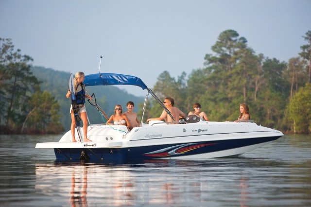 The deckboat is a cross between a bowrider and a pontoon boat.  It features a rather flat deck area with lots of room for people while still offering the speed and agility of a runabout.